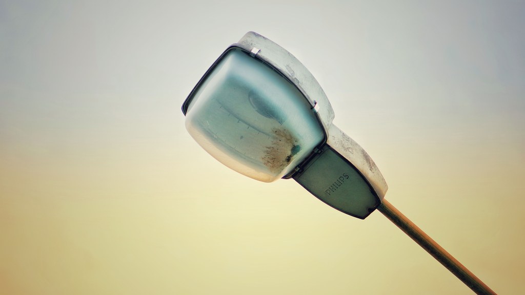Detailed view of a street lamp against a serene sky in Nakrakonda, West Bengal.