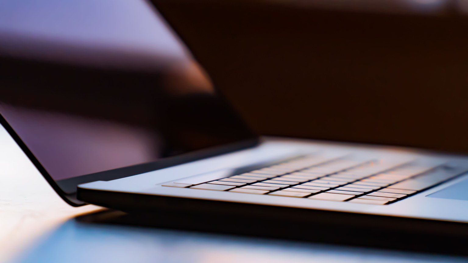 A detailed view of a laptop keyboard with shallow depth of field.