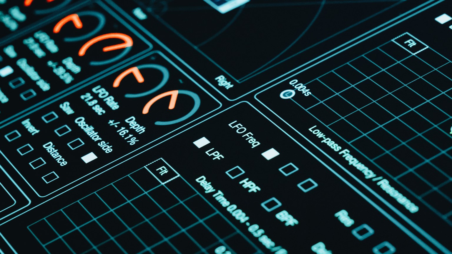 Close-up of a digital interface showcasing futuristic graphs and data analytics in low light.