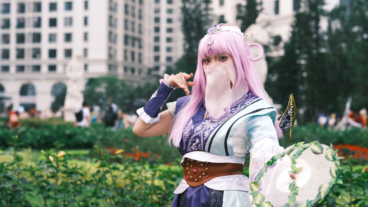 A captivating cosplay character posing in a vibrant urban garden setting in Vietnam.