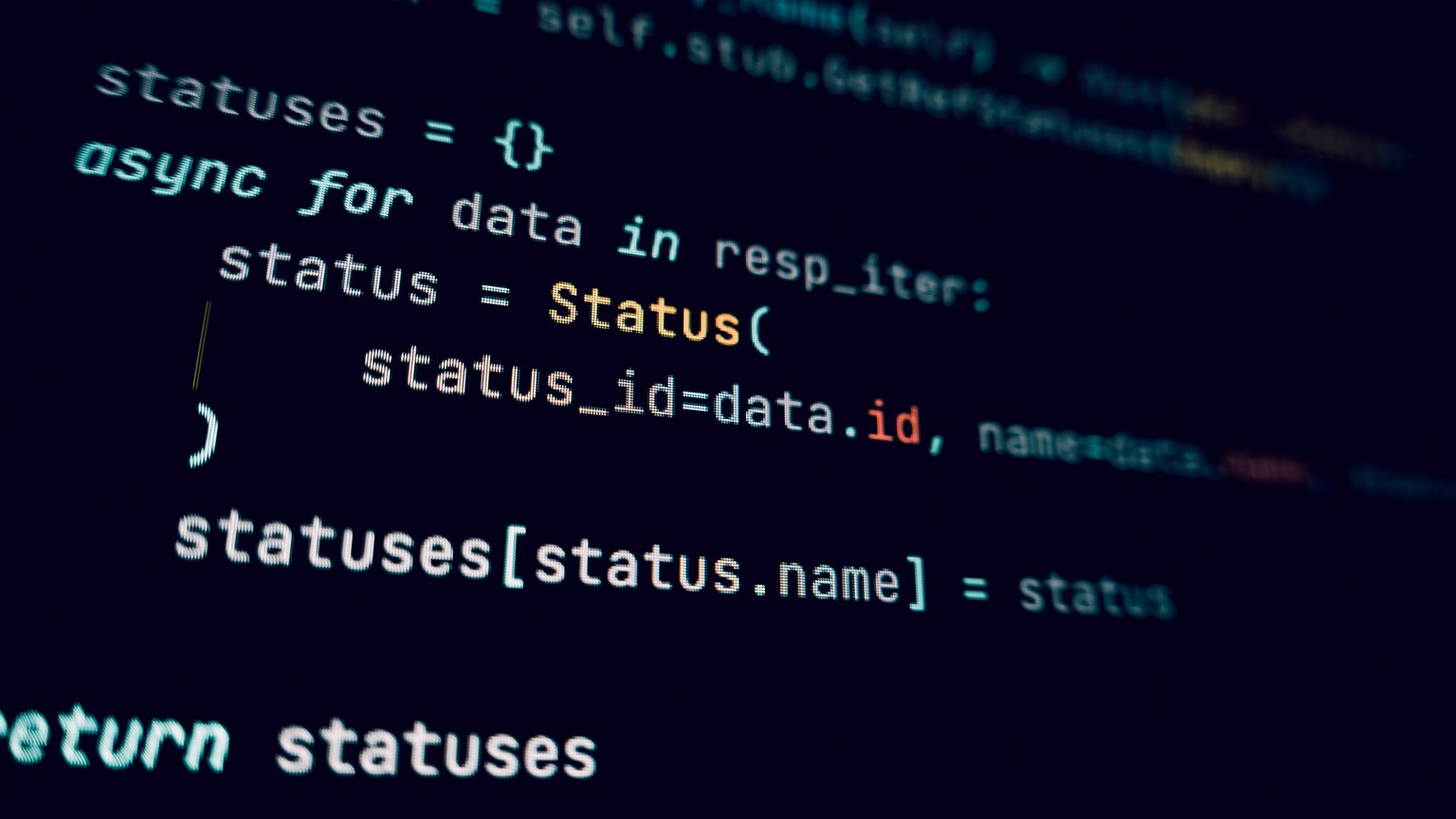 Detailed view of programming code in a dark theme on a computer screen.