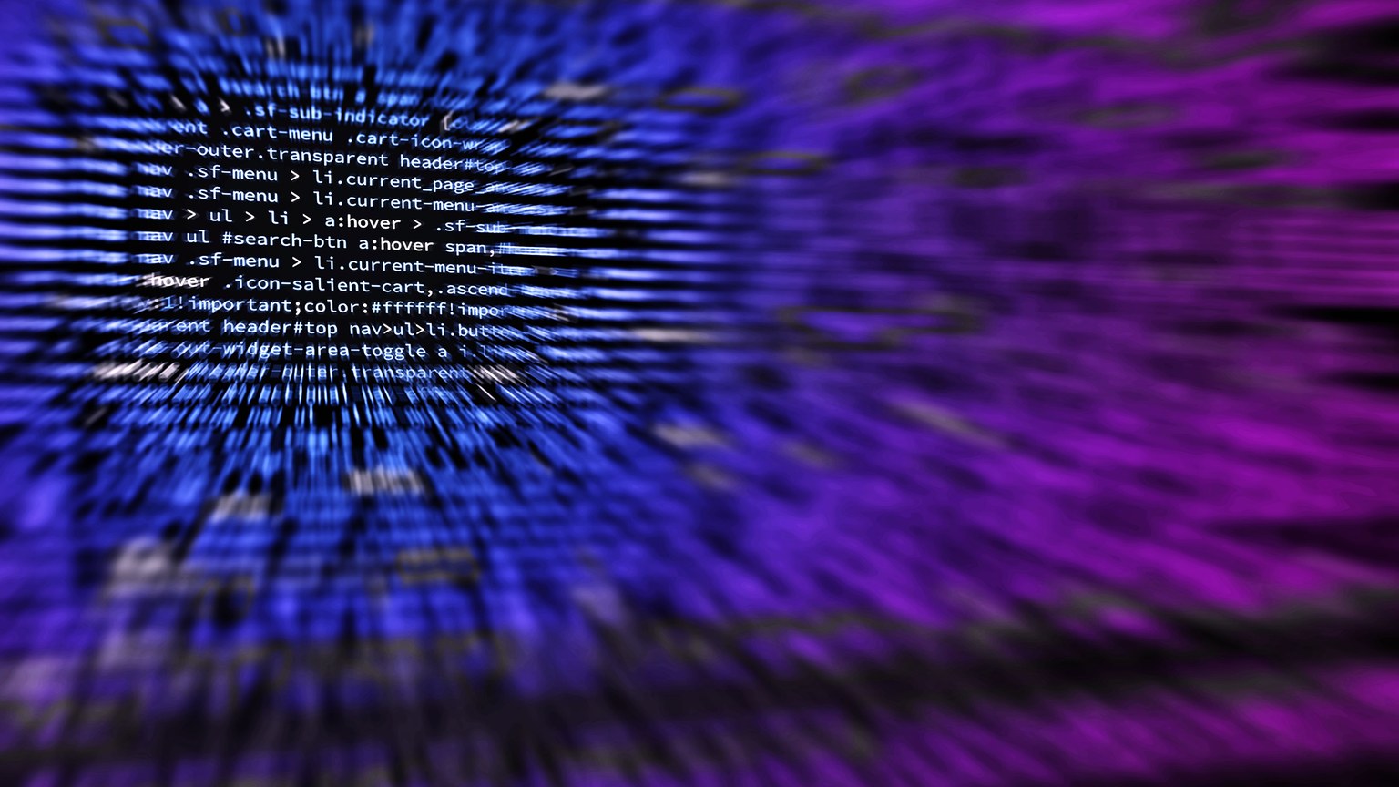 Dynamic abstract background featuring computer code in focus with blurred effect.