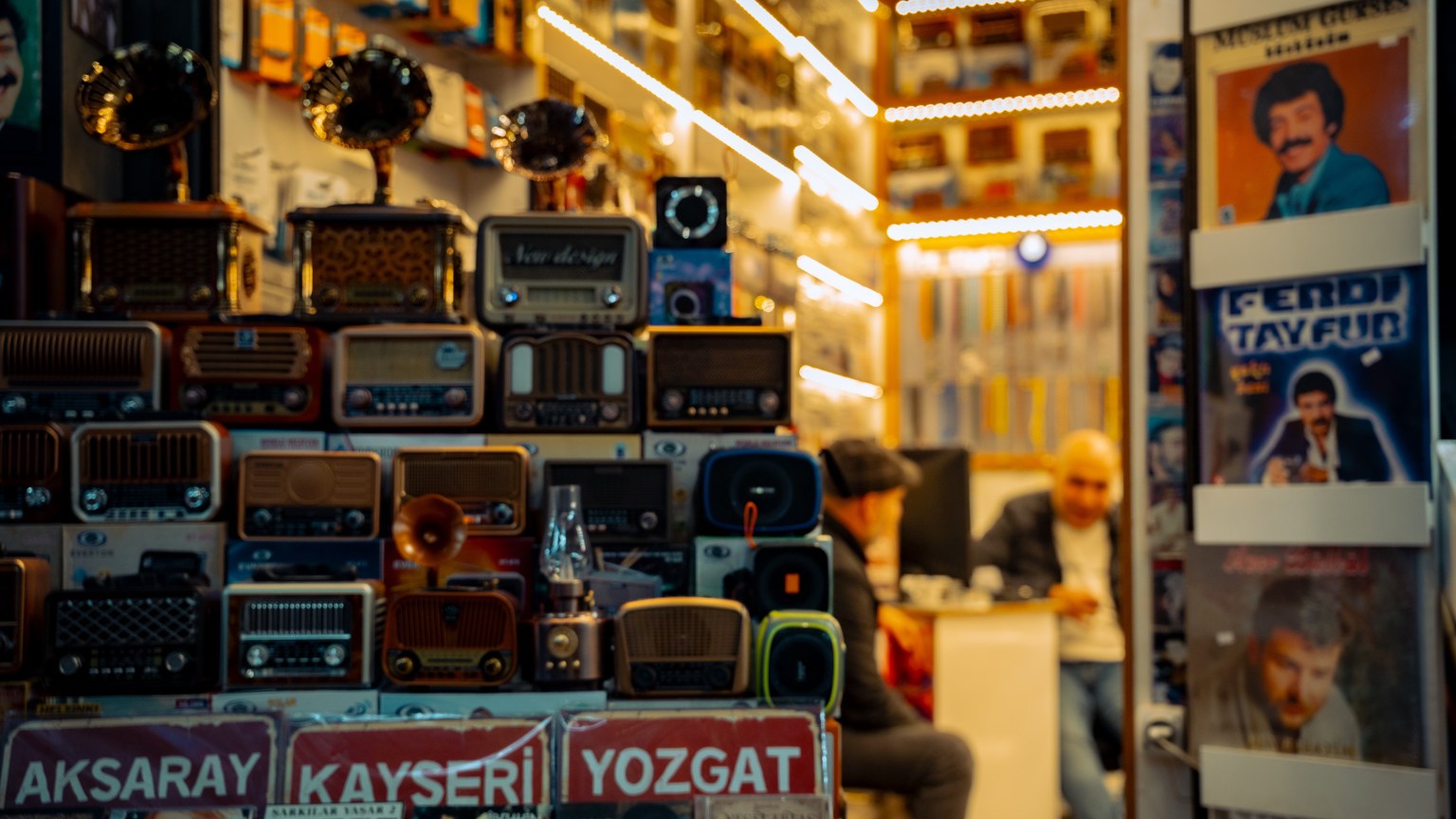 A cozy vintage store filled with retro radios and records, exuding a nostalgic atmosphere.