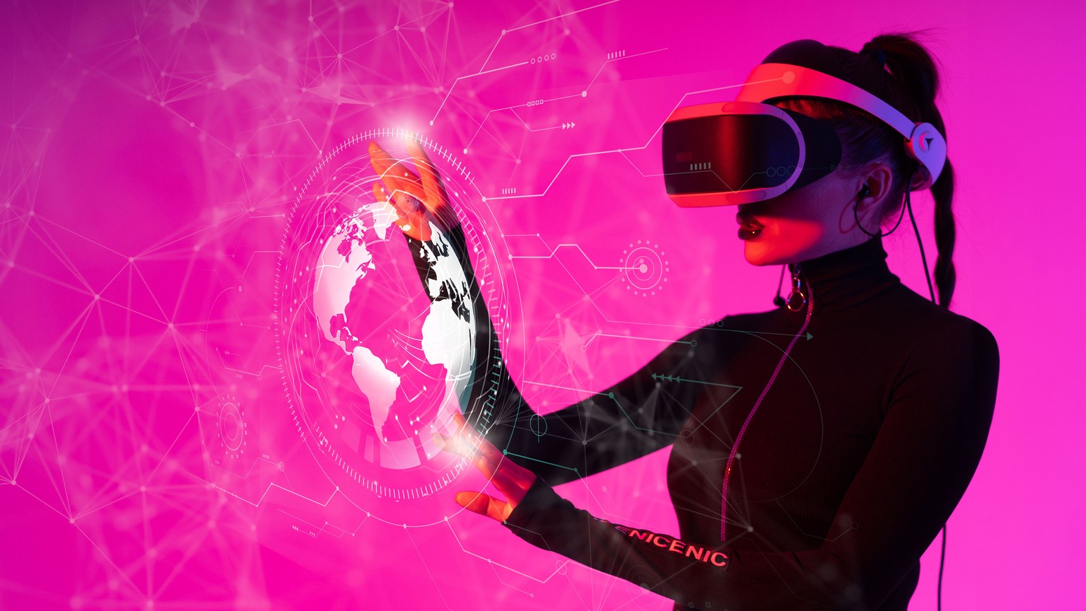 A woman interacts with a VR hologram in a futuristic studio setting.