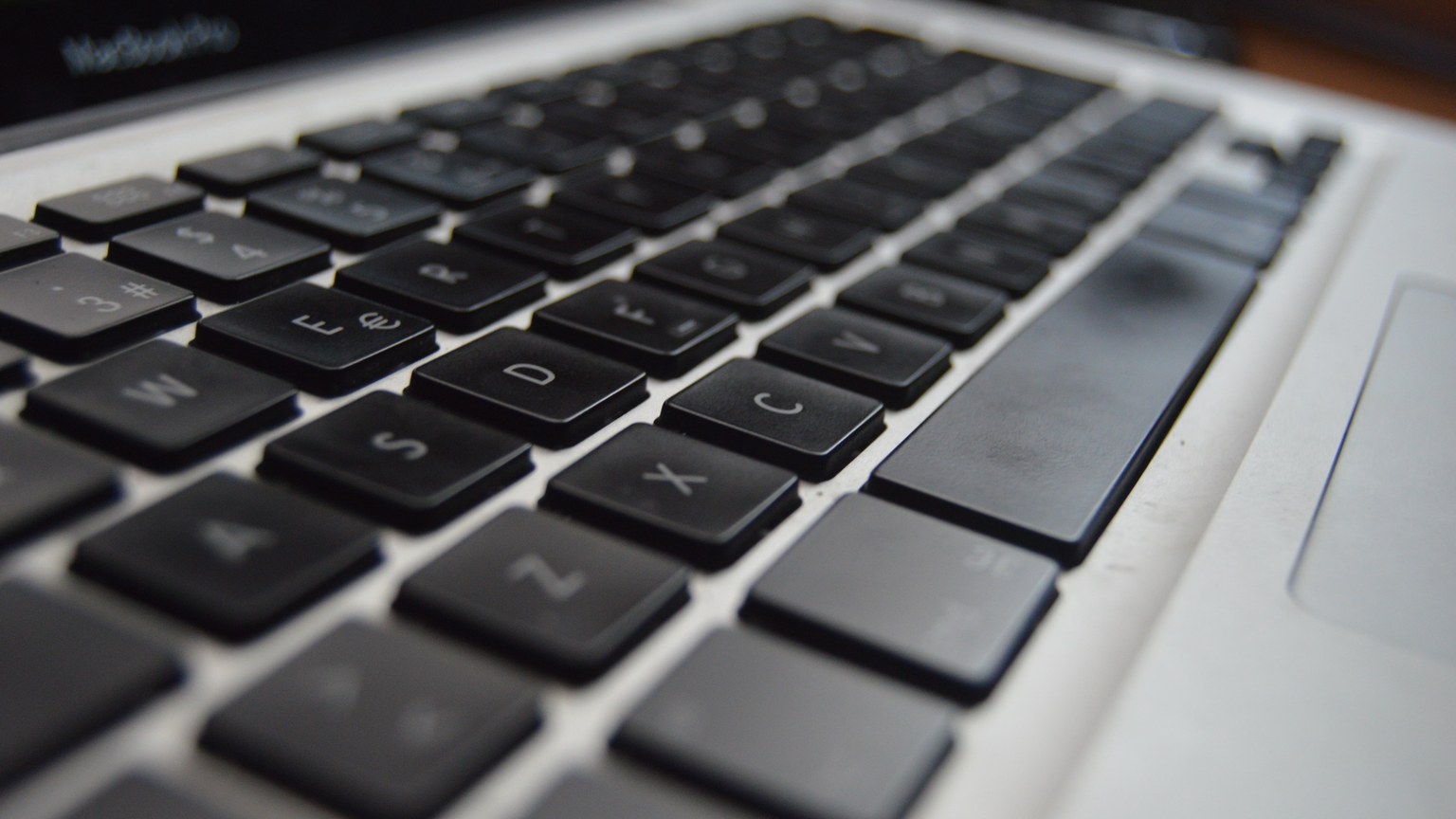 Detailed close-up of a laptop keyboard showcasing technology and productivity aspects.
