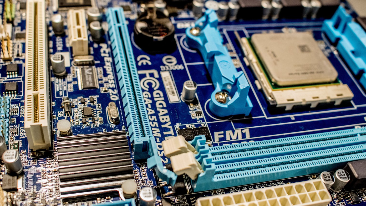 Detailed close-up image of a computer motherboard showcasing various electronic components.