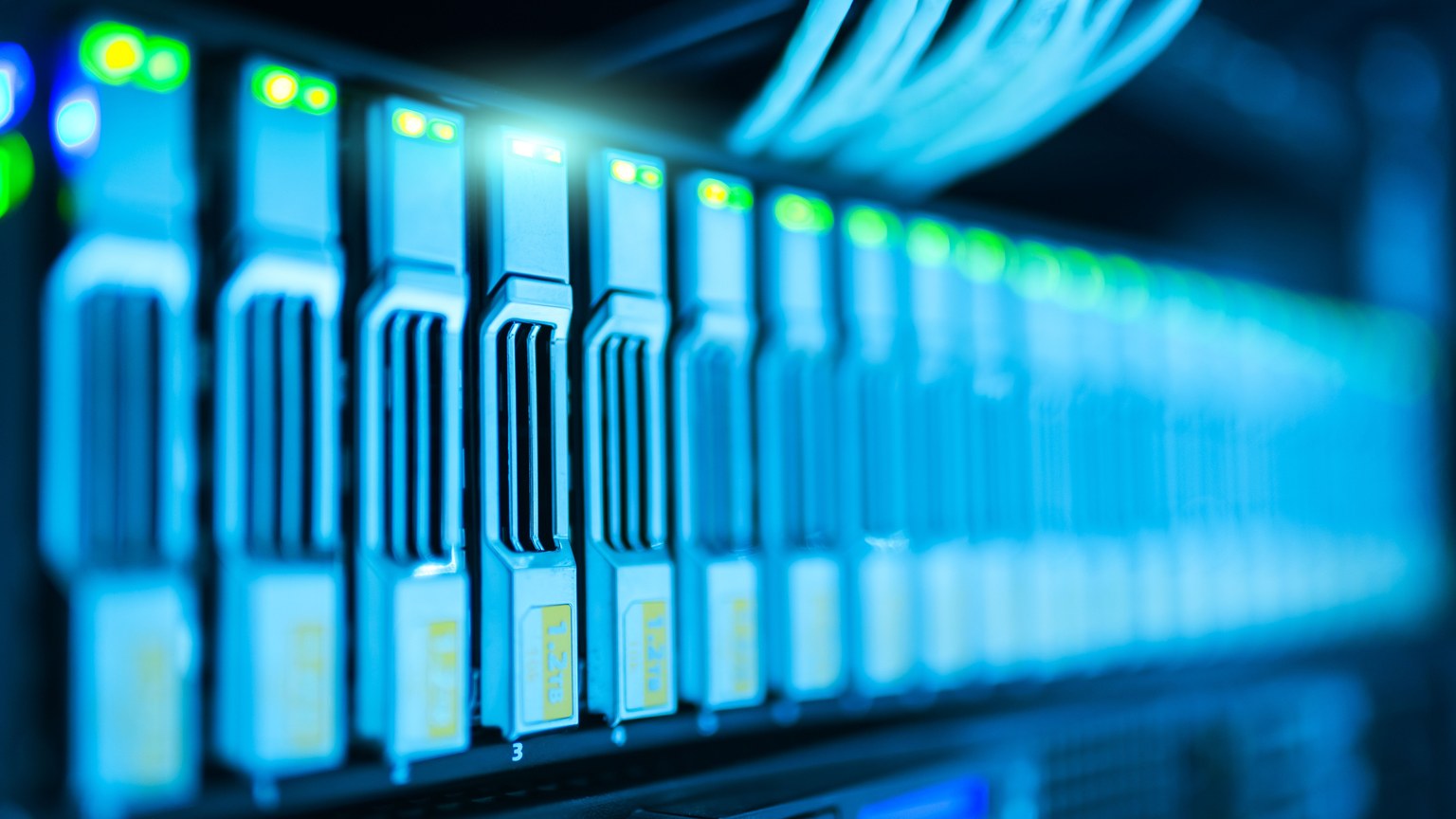 Detailed image of a server rack with glowing lights in a modern data center.