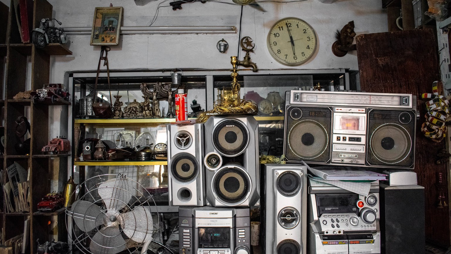 A collection of vintage electronics and antiques in an Algerian shop.