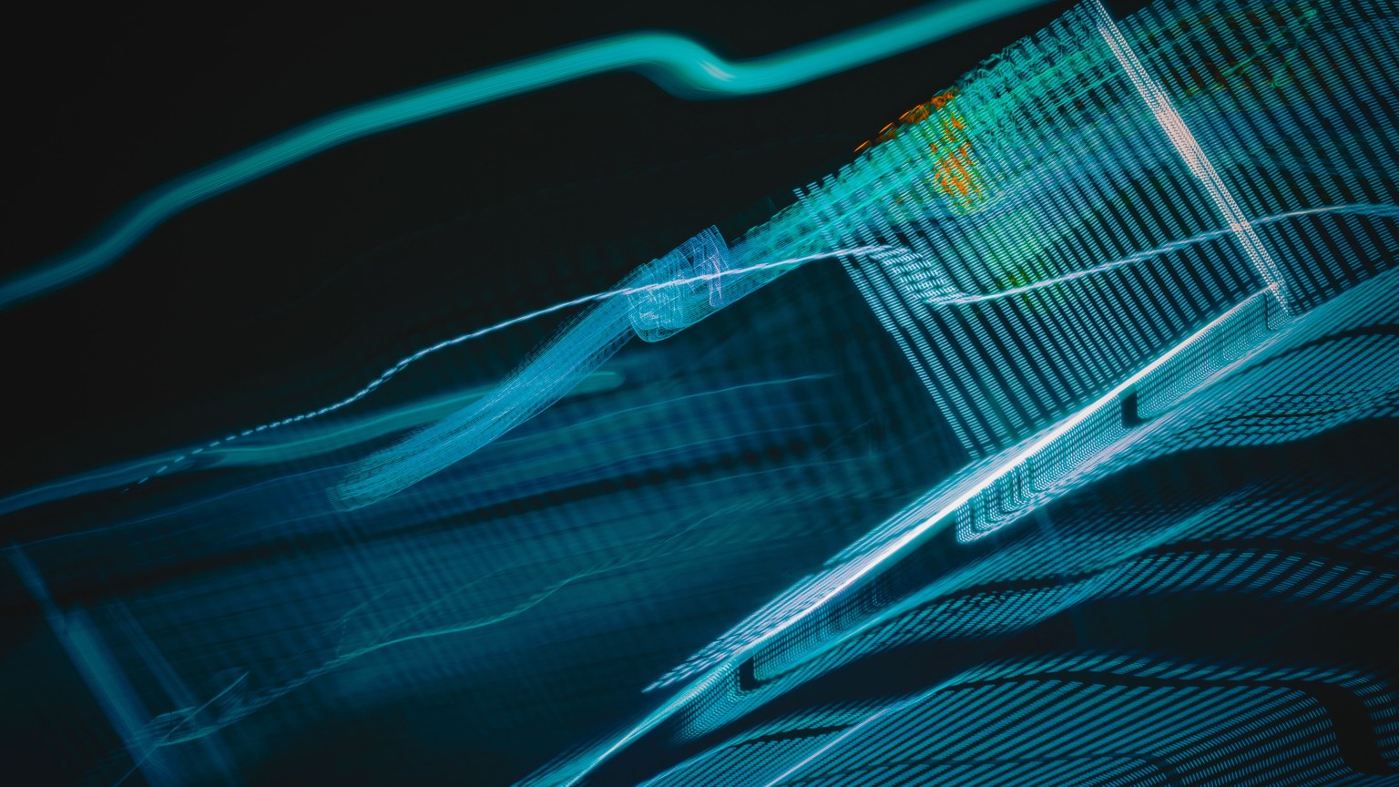 Abstract digital artwork with blue light streaks on a dark background, creating a futuristic feel.