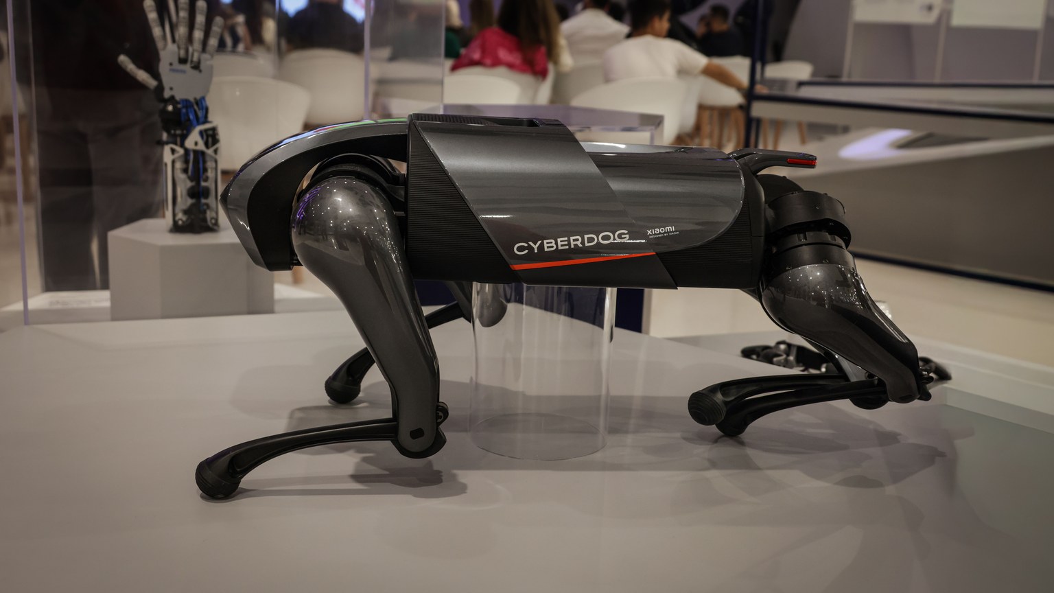 A futuristic robot dog, the Cyberdog, on display in an indoor setting, showcasing advanced robotics technology.