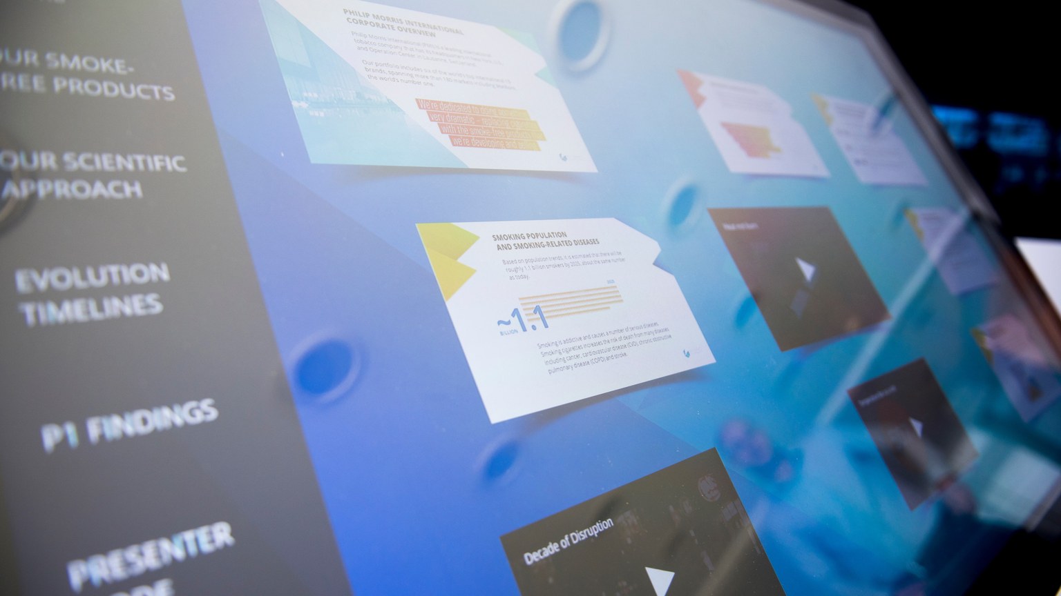 Close-up of a digital touchscreen displaying various data and graphics.