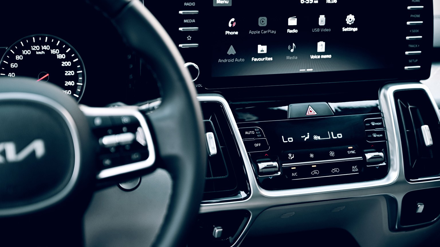 Close-up view of a luxury car's dashboard featuring a modern touchscreen display and advanced features.