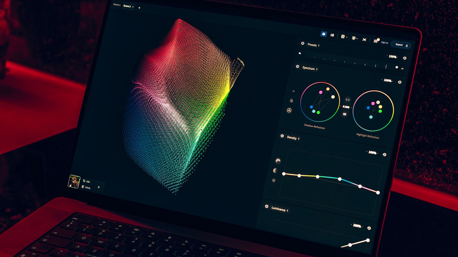 Close-up of a colorful data visualization displayed on a laptop screen in a dimly lit room.