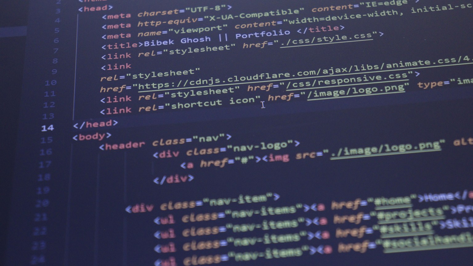 Close-up view of HTML and CSS code displayed on a computer screen, ideal for programming and technology themes.