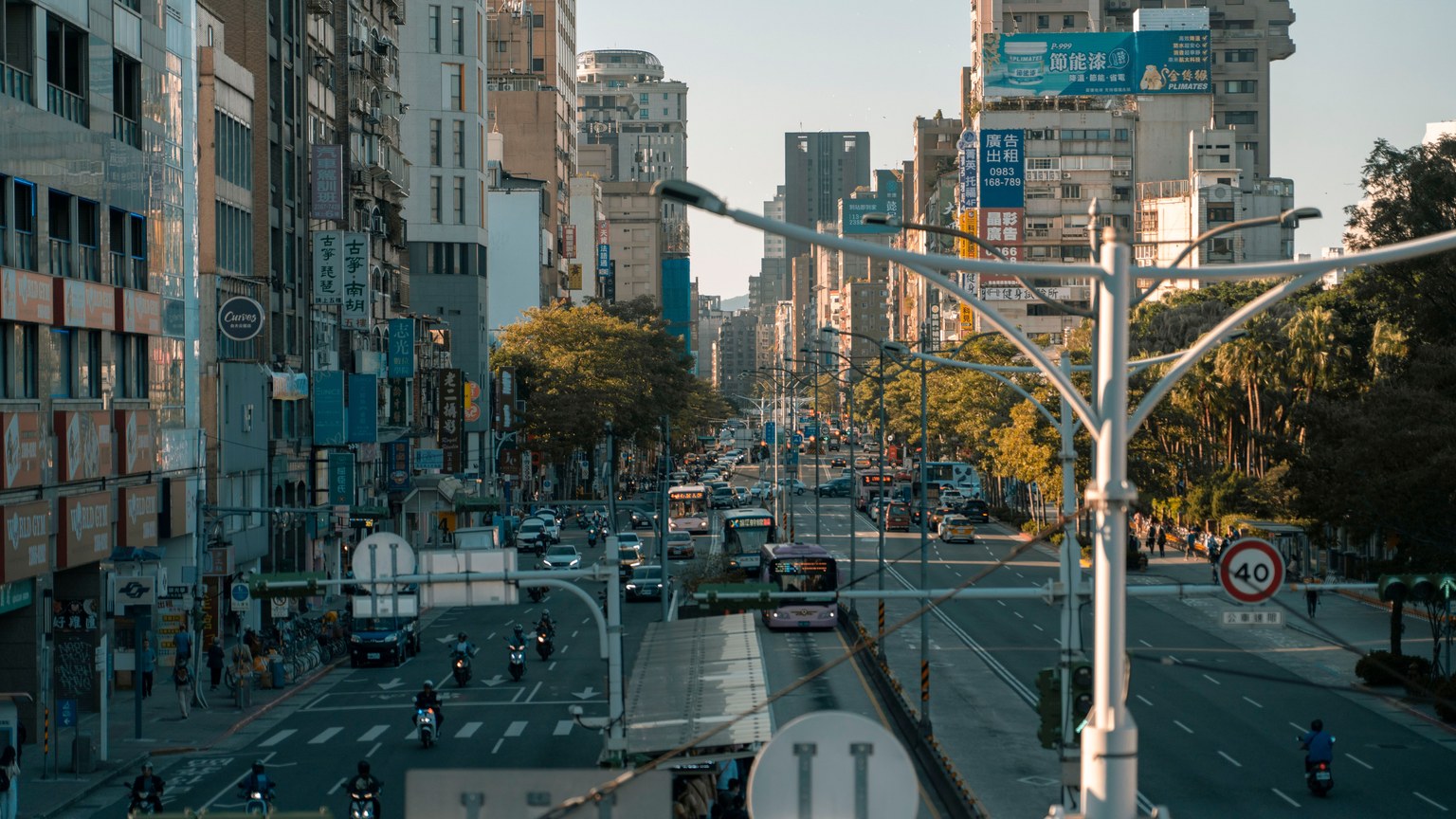 A busy street scene showcasing the vibrant urban life in a modern cityscape.