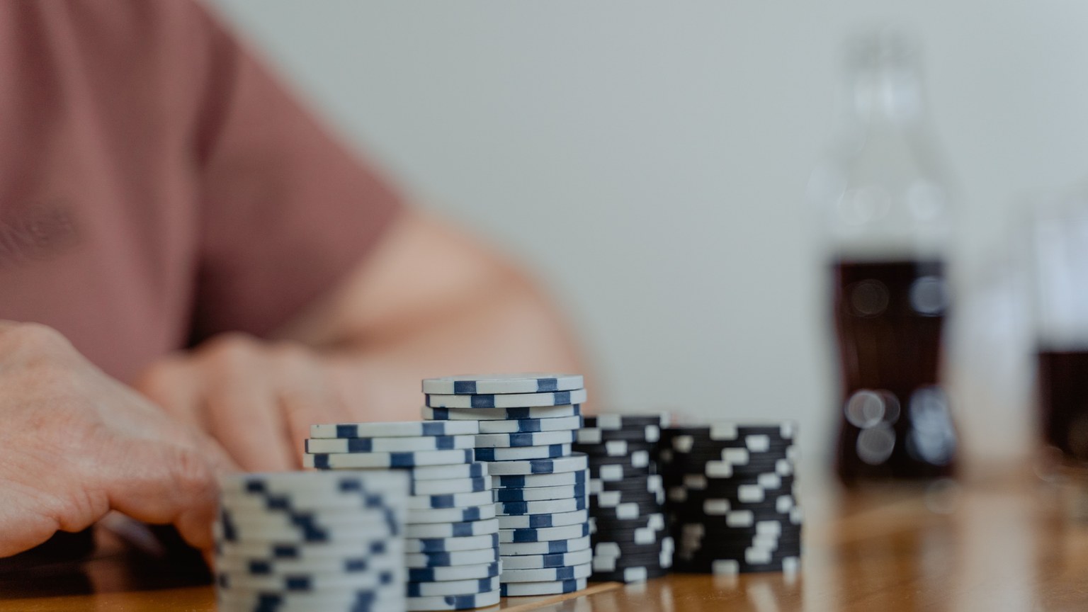 Poker chips neatly stacked on a table, ready for play.