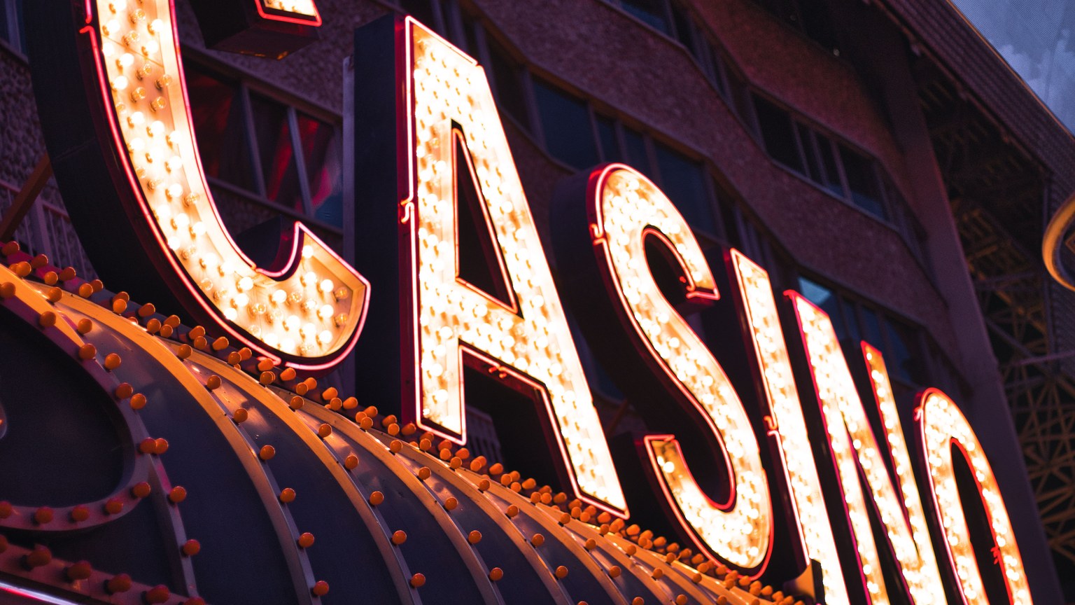Brightly illuminated casino sign in Las Vegas, capturing the city's vibrant nightlife atmosphere.