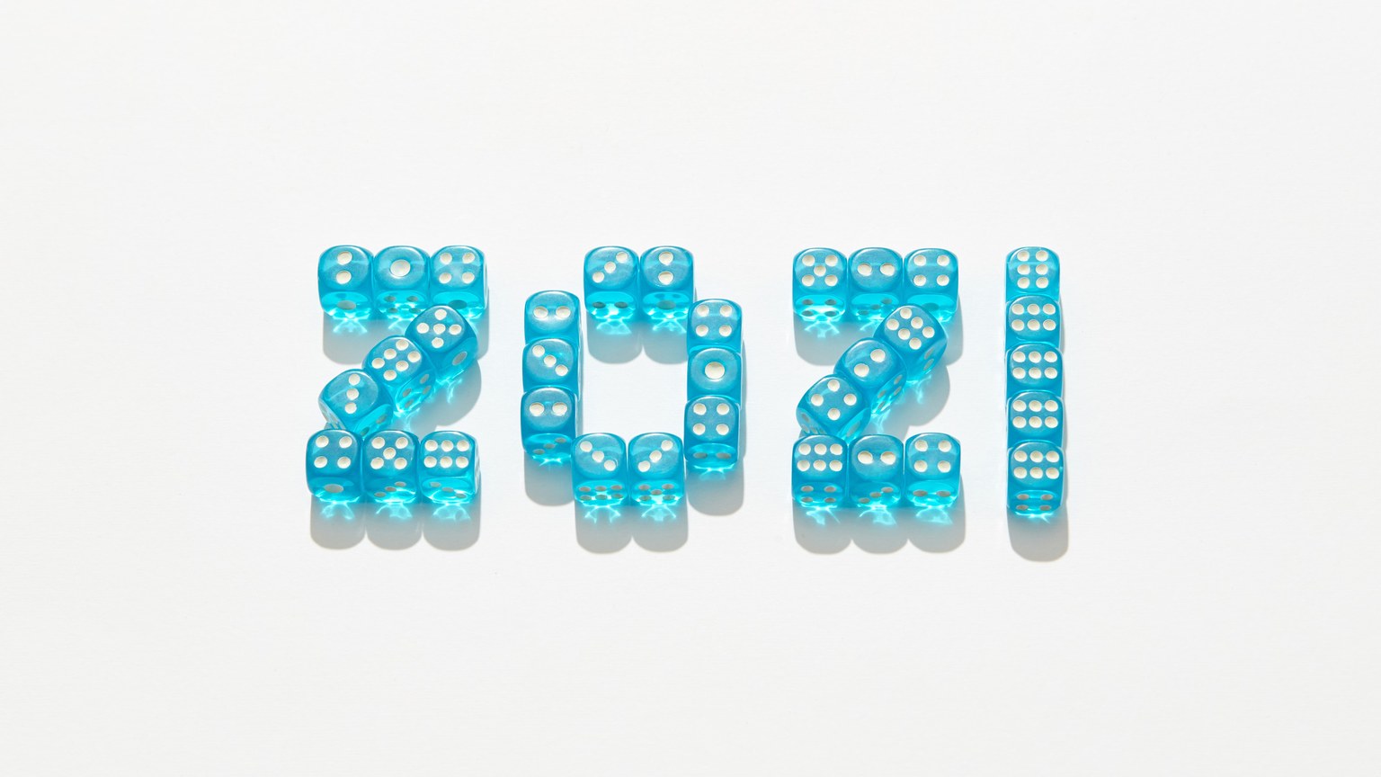 Blue dice arranged to form 2021, symbolizing the New Year.