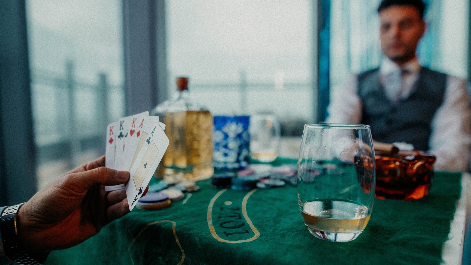A captivating poker game scene with whiskey in Buenos Aires, illustrating leisure and strategy.